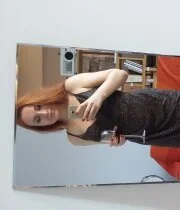 Redhead fingering her cunt