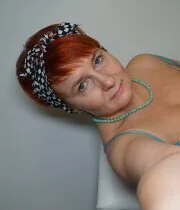 Redhead mature loves teasing in all kinds of naughty outfits