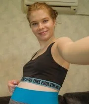 Cute teen babe showing off her nice natural tits in her bedroom