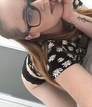 Tattooed amateur babe pulls out her tits while posing
