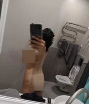 Amateur busty MILF taking hot selfies in her hotel bathroom