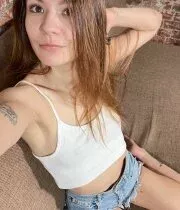 Skinny brunette teen shows off her figure in her bedroom