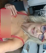 Busty blonde MILF strips down and shows her nice tits