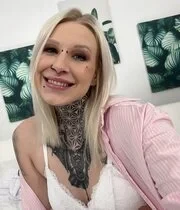 Tattooed blonde showing her body