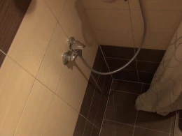 Hidden camera shows a mature woman showering her luscious tits