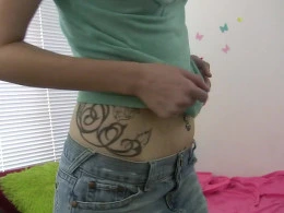 Petite teen shoves her fingers deep inside her wet pussy
