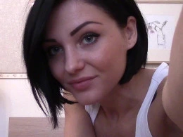 Black haired cutie fingering her pussy