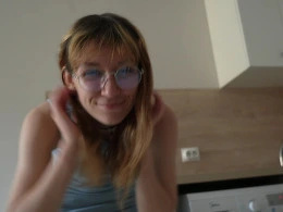 Little redhead masturbating in the ktichen