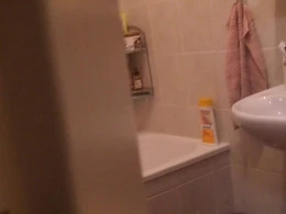 Busty woman gets filmed while taking a very sexy shower