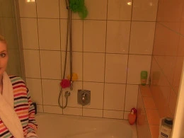 Pretty blonde wife taking shower and gets recorded