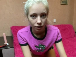 Blonde with tattoos records herself being naughty on the bed
