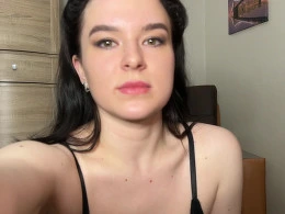 Playing around on a leather chair with a sex toy