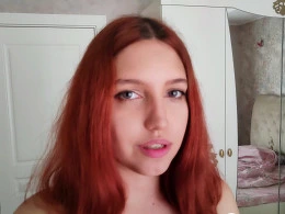 Redhead cutie fingering her wet pussy next to her sleeping BF