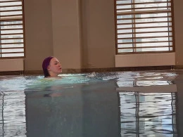 Purple haired chick drops down on her knees to suck a dick