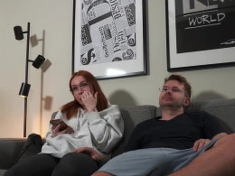 Amateur couple having sex on the couch in the living room